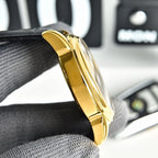 Omega Seamaster gold-tone case side view with crown and black leather strap