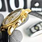 Omega Seamaster gold-tone watch side profile on black leather strap