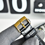 Omega Seamaster gold-tone watch buckle on black leather strap