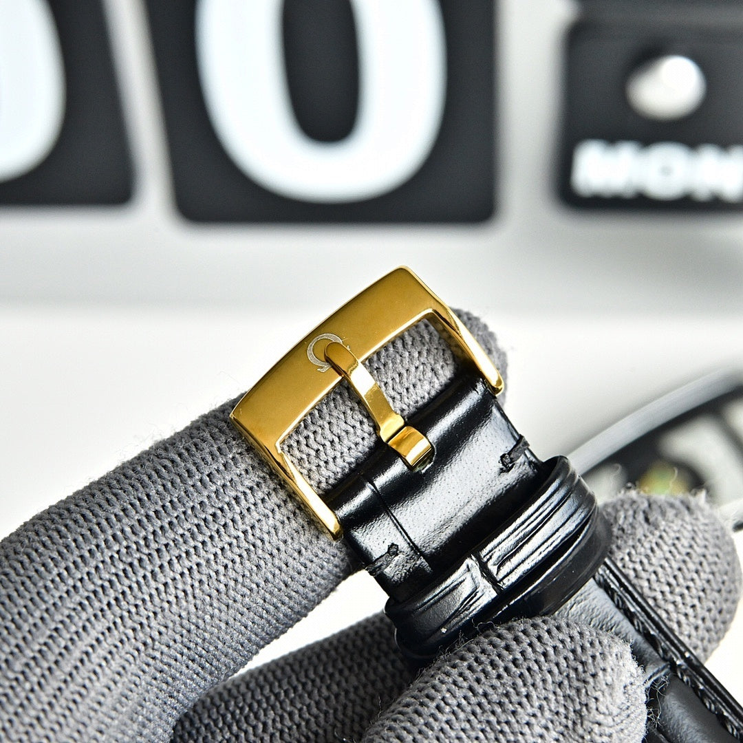 Omega Seamaster gold-tone watch buckle on black leather strap