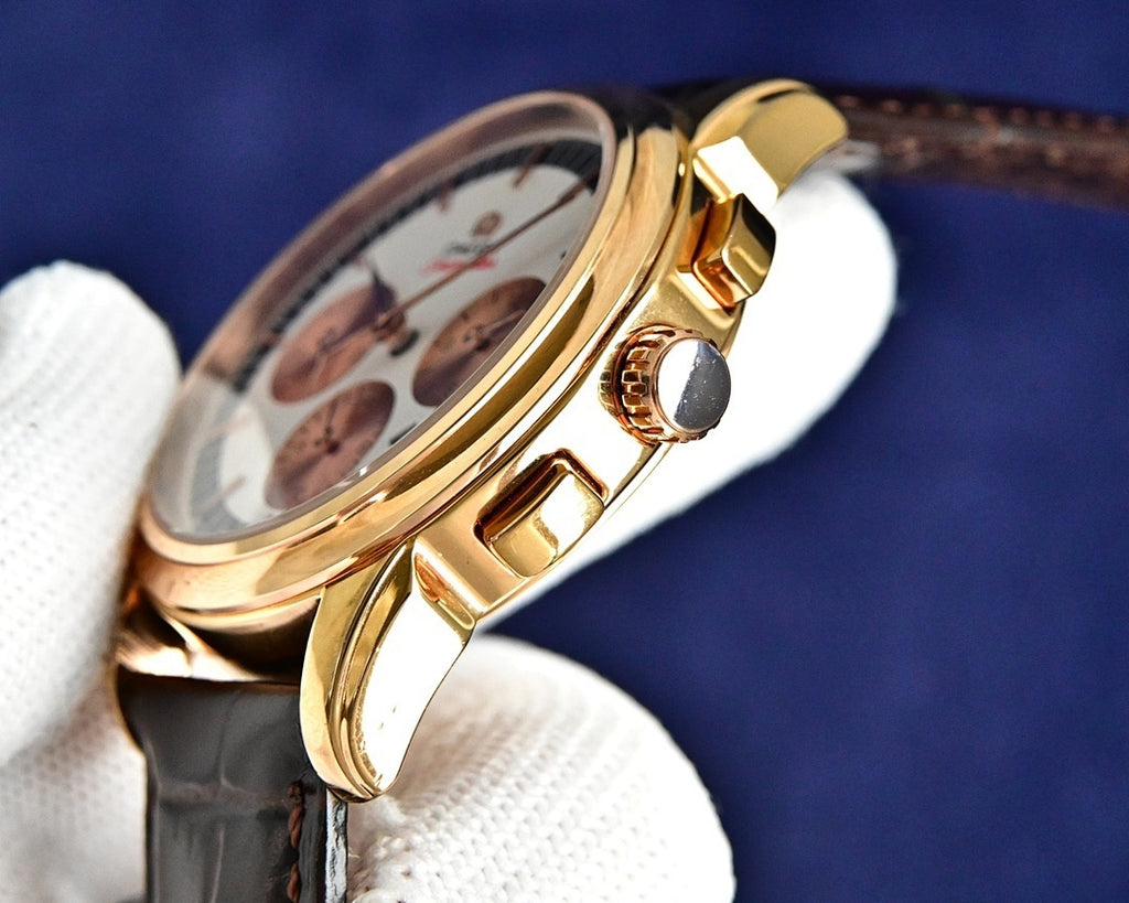 Omega watch side view with crown and gold-tone case on brown leather strap.