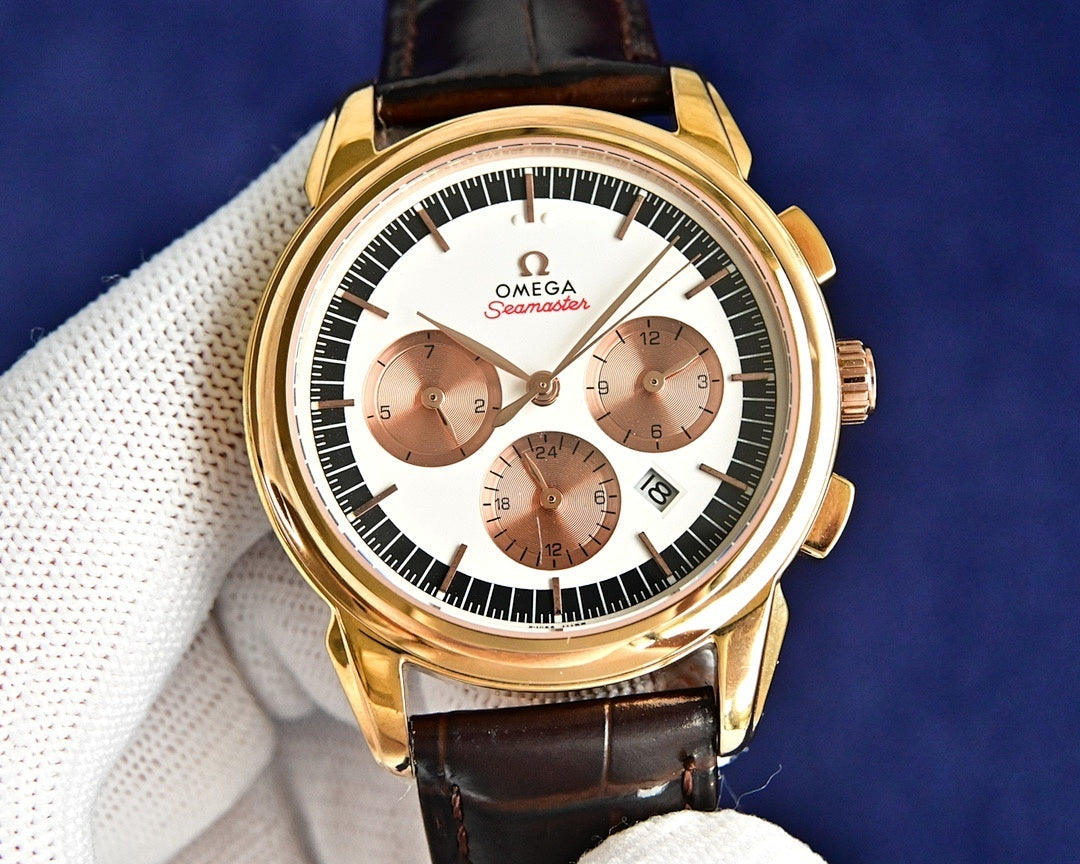Omega Seamaster watch with gold case, white dial, brown leather strap, 3 subdials.