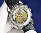 Omega Seamaster watch case back with visible mechanical movement and gold-toned details