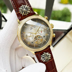 Omega watch with brown leather strap, gold-tone bezel, champagne dial with skeleton movement
