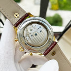 Omega watch case back with visible movement, brown leather strap, gold-tone crown and text
