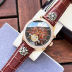 Omega watch with brown leather strap, gold-tone bezel, dark dial with skeleton subdials