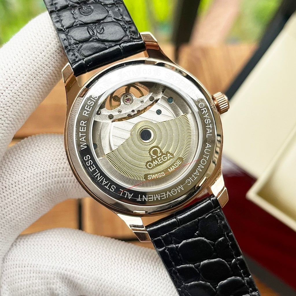 Omega De Ville wristwatch caseback view with engraved bezel and black leather strap.