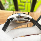 De Ville wristwatch side view with silver case and black leather strap