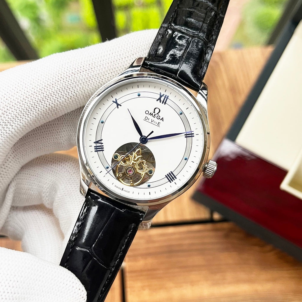 De Ville wristwatch close-up with black leather strap, white dial and silver case
