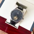 De Ville wristwatch with black leather strap, dark round dial, silver case