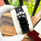 De Ville wristwatch close-up with black leather strap and silver case