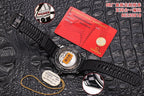 Diver watch with black rubber strap on dark leather, red warranty card and tag included