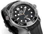 Black dial diver watch with silver bezel, white markers, and black rubber strap.