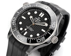 Diver watch with black rubber strap, black dial, and silver hands and markers.