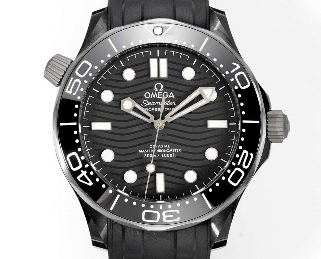 Black dial diver watch with stainless bezel and black rubber strap.