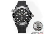 Black diver watch on black rubber strap with black dial and stainless bezel.