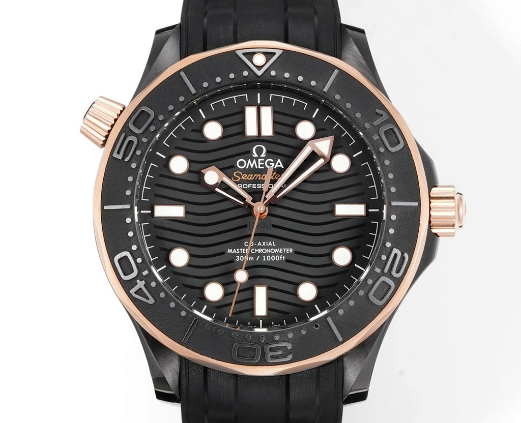 Front view of black rubber diver watch with rose-gold bezel, black dial, and gold-tone hands.