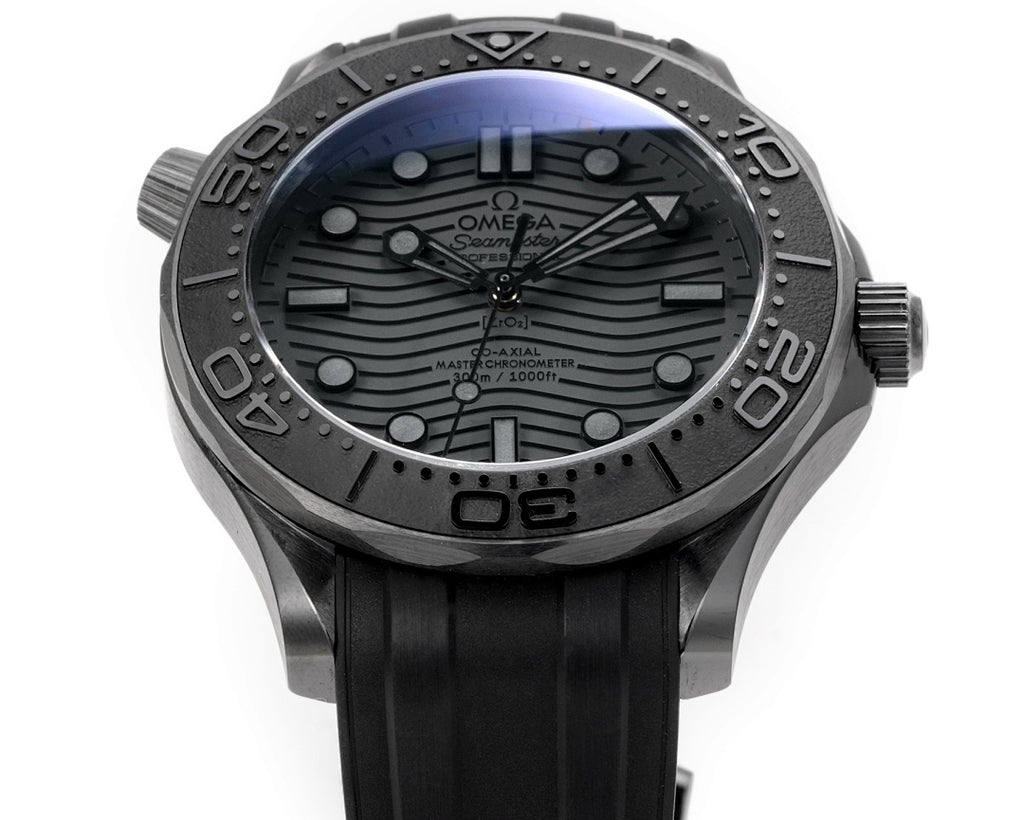Omega Seamaster watch with black dial and black rubber strap, round bezel and markers.