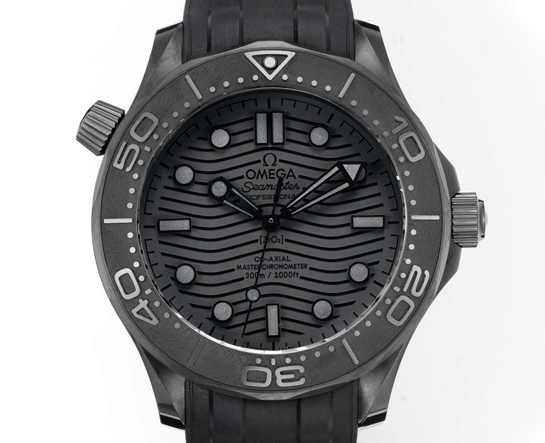 Omega Seamaster watch front with black dial, baton markers, and black rubber strap.