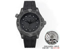 Omega Seamaster watch with black dial and black rubber strap, round case and bezel.