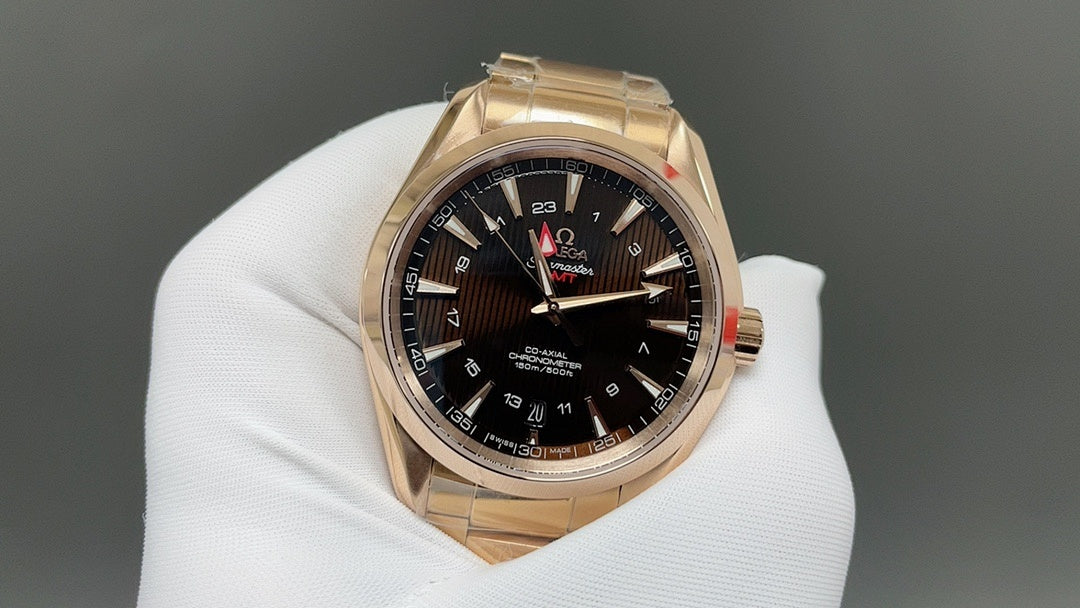 Gold Omega wristwatch with black dial, red seconds hand and date window