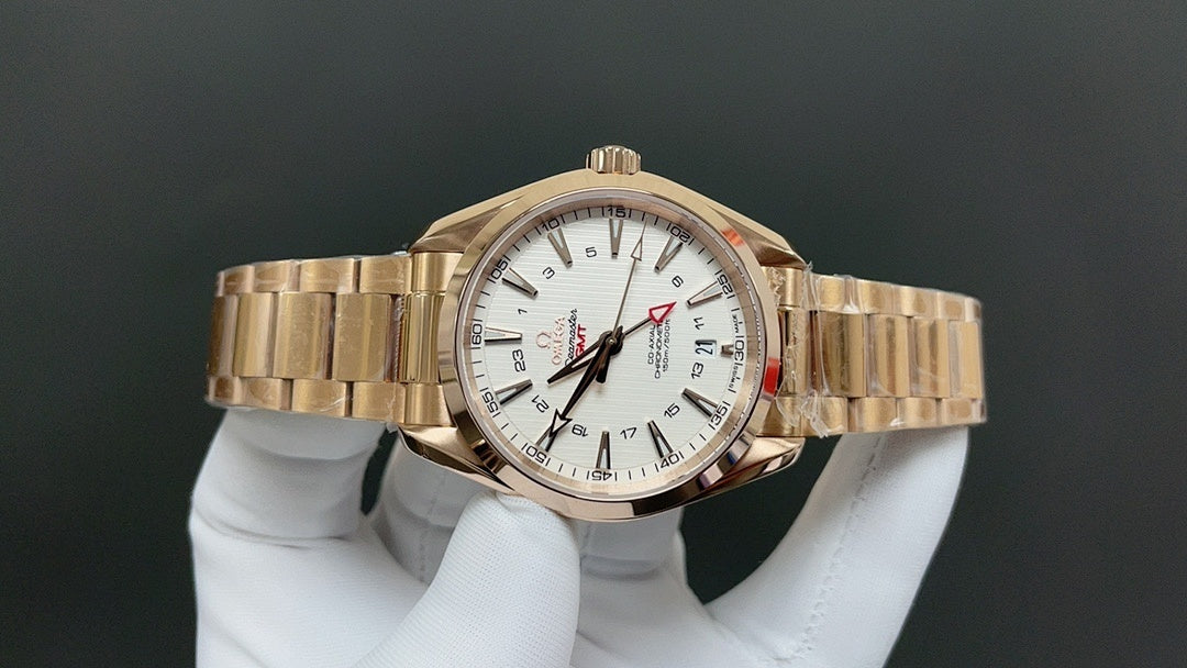 Gold wristwatch side view, white dial and gold bracelet link band
