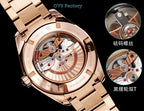 Omega Seamaster GMT wristwatch with rose-gold caseback and visible mechanical movement