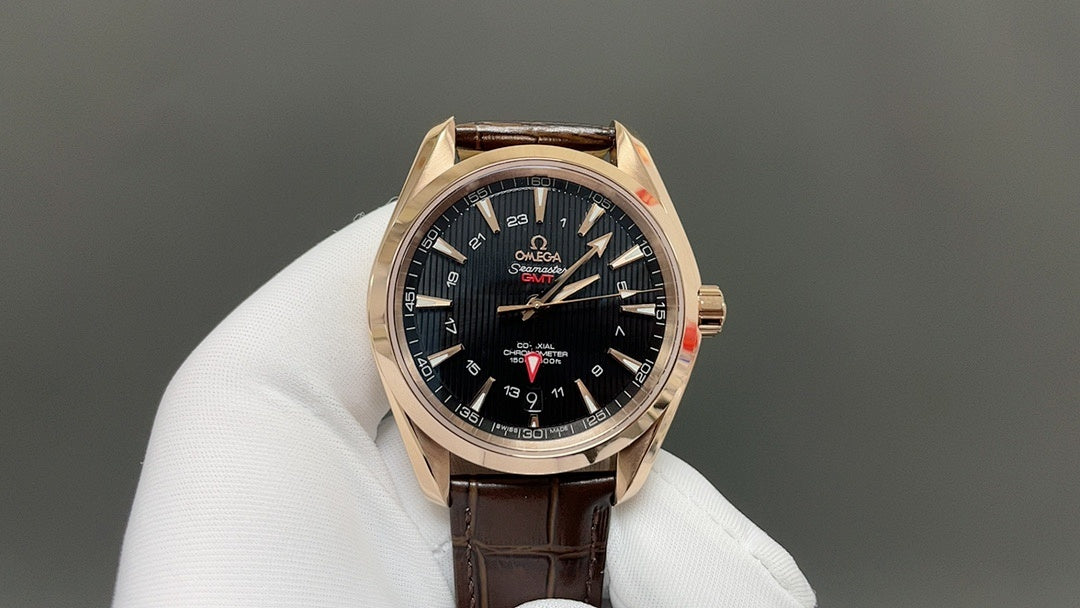Analog wristwatch with black dial, gold-tone bezel, and brown leather strap