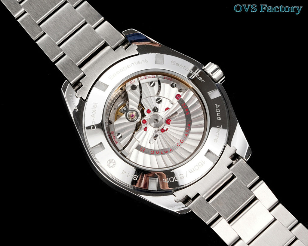 Omega watch with metal bracelet and transparent caseback showing mechanical movement