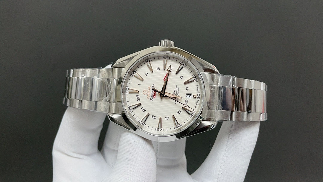 Omega watch with silver bracelet, white dial, red-accent hands, and date window