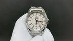 Omega watch with silver bracelet and white dial, red and black GMT-style markings