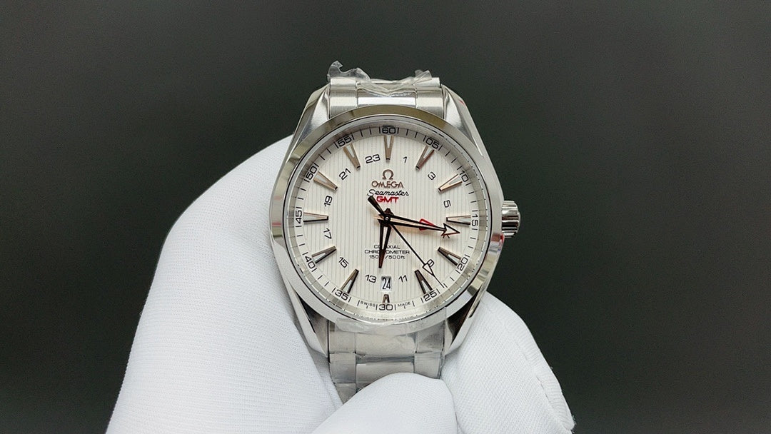 Omega watch with silver bracelet and white dial, red and black GMT-style markings