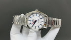 Omega watch front view with silver bracelet, white dial, blue markers, and crown
