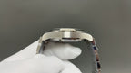 Omega watch caseback close-up with polished silver metal back and crown