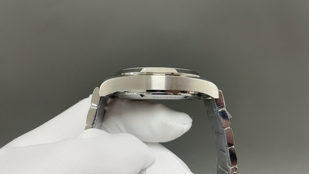 Omega watch caseback close-up with polished silver metal back and crown