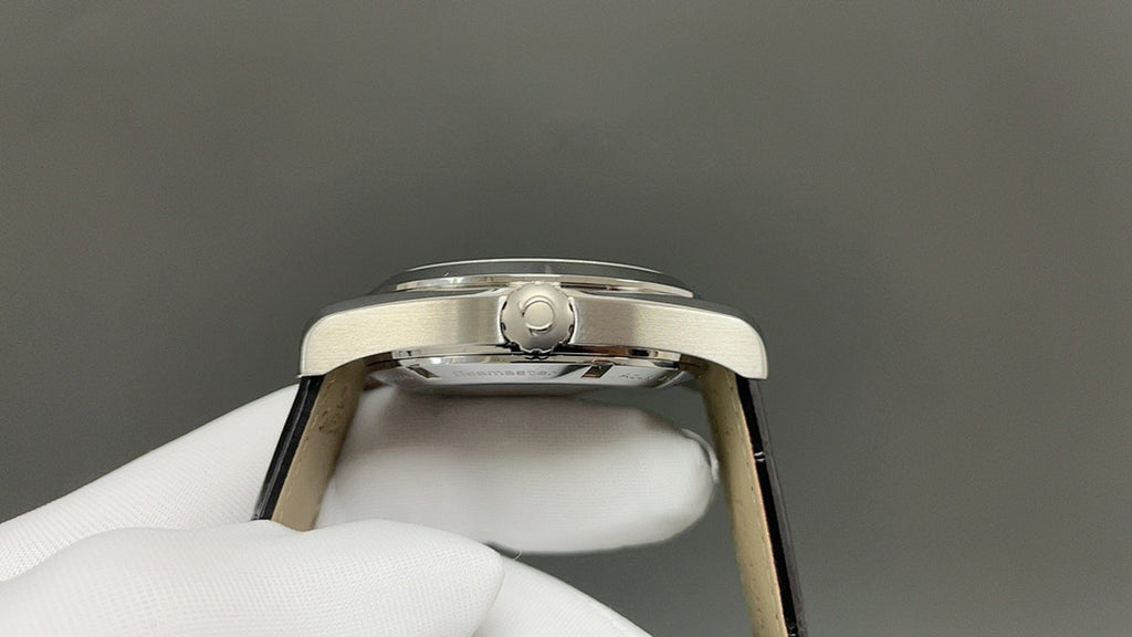 Omega watch caseback with crown detail and black leather strap