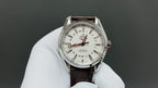 Omega watch front with white dial, markers, and brown leather strap