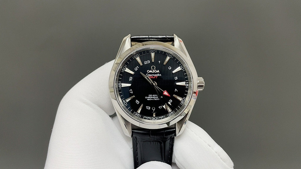 Omega watch front with black dial, silver bezel, and black leather strap