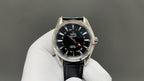 Omega watch front with black dial, silver bezel, and black leather strap