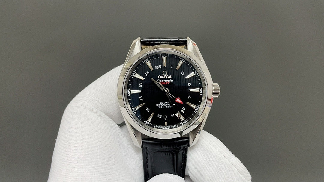 Omega watch front with black dial, silver bezel, and black leather strap