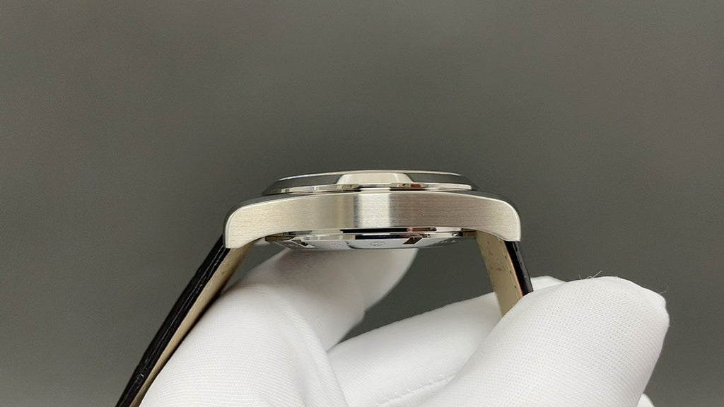 Omega watch side profile with silver case and black leather strap