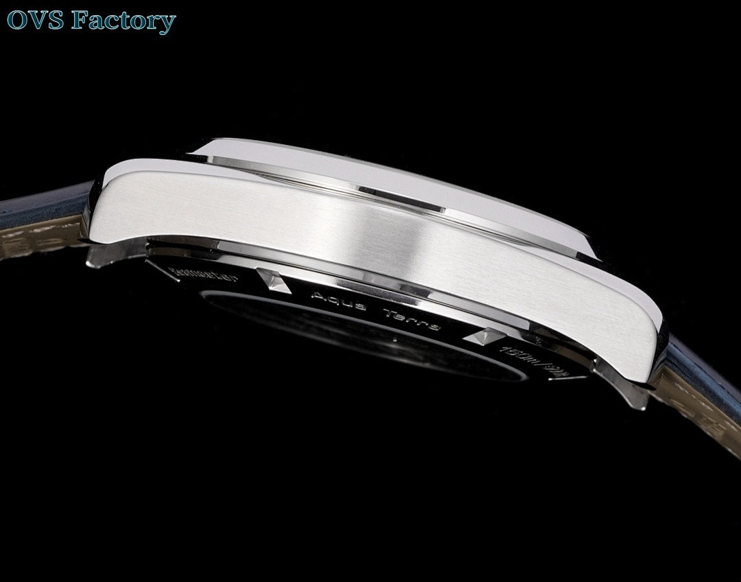 Omega wristwatch stainless case side profile with crown.