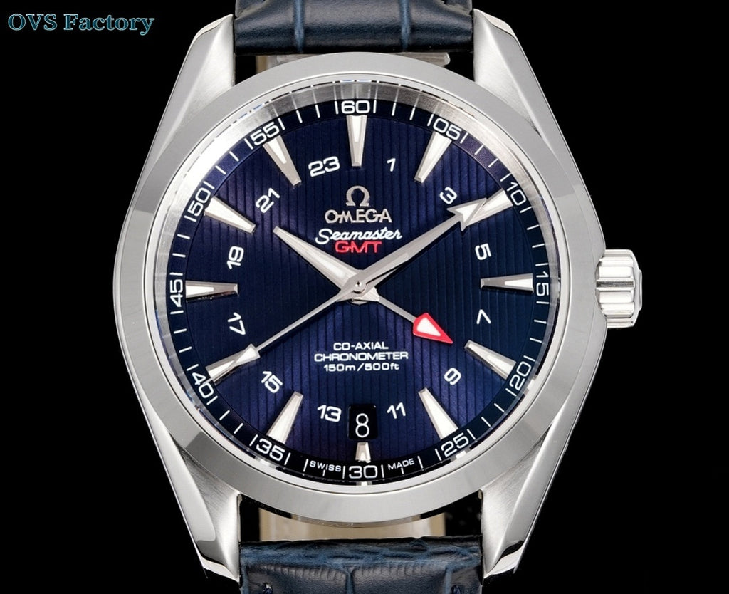 Omega wristwatch front view with navy dial, red accent triangle, dark blue leather strap.