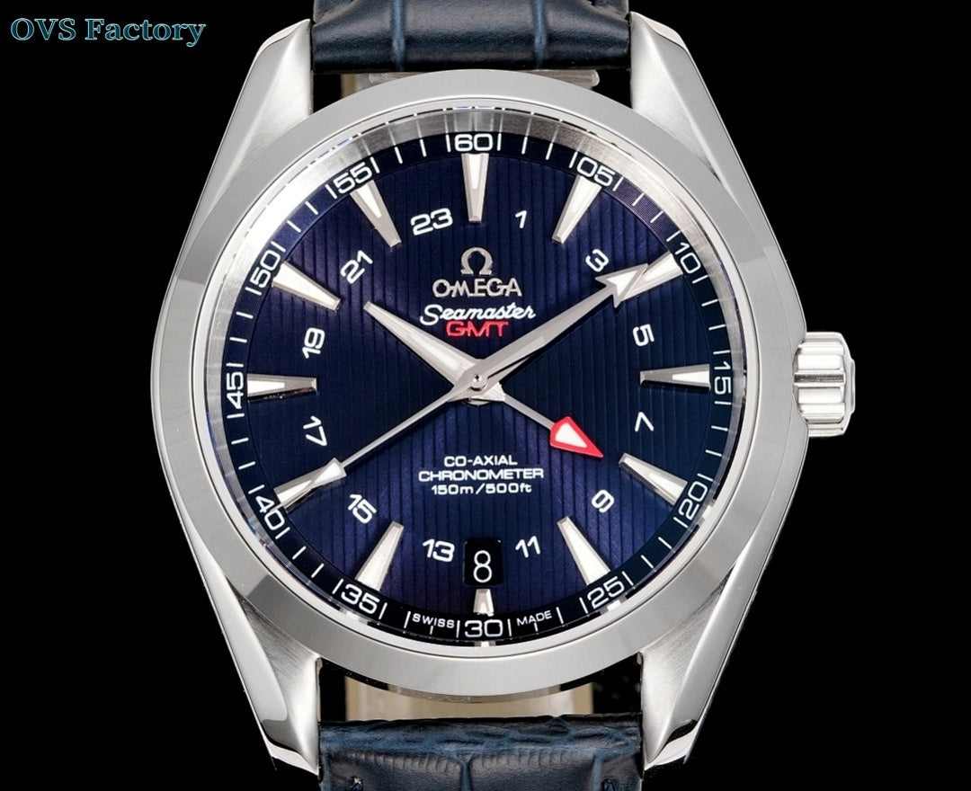 Omega wristwatch front view with navy dial, red accent triangle, dark blue leather strap.