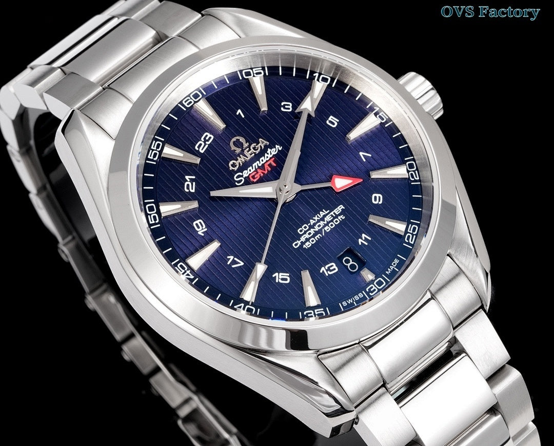 Analog wristwatch angled view with blue dial, stainless steel bracelet, and bezel markers.