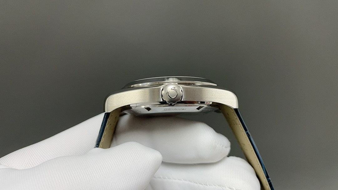 Wristwatch case back view with screw-down center and blue strap