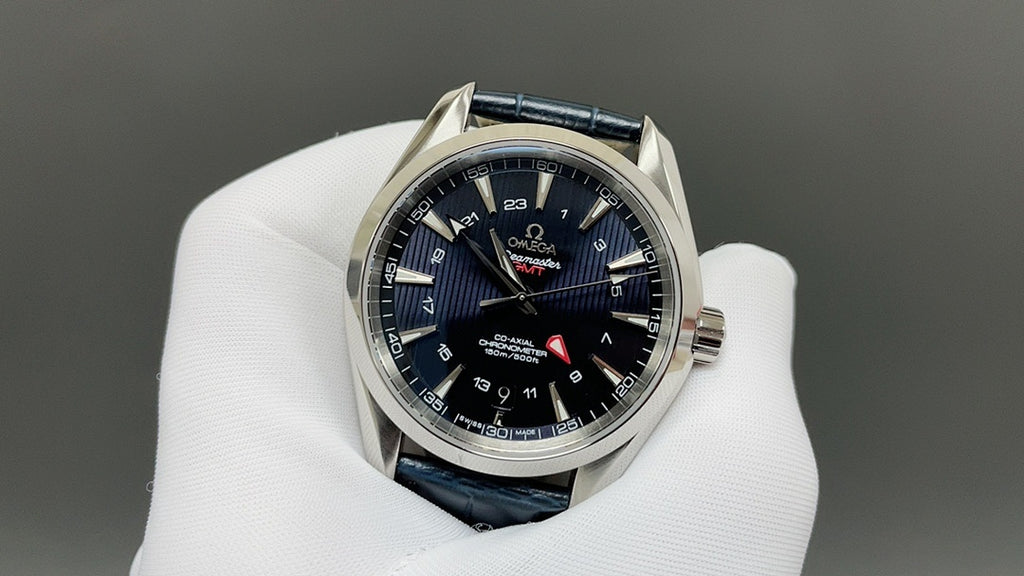 Wristwatch with dark blue dial, blue leather strap, silver case and red seconds hand