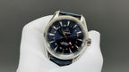 Wristwatch with dark blue dial, blue leather strap, silver case and red seconds hand