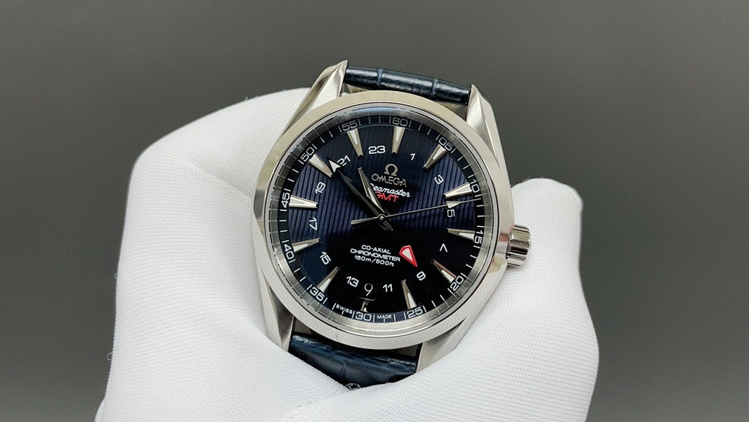 Wristwatch with dark blue dial, blue leather strap, silver case and red seconds hand