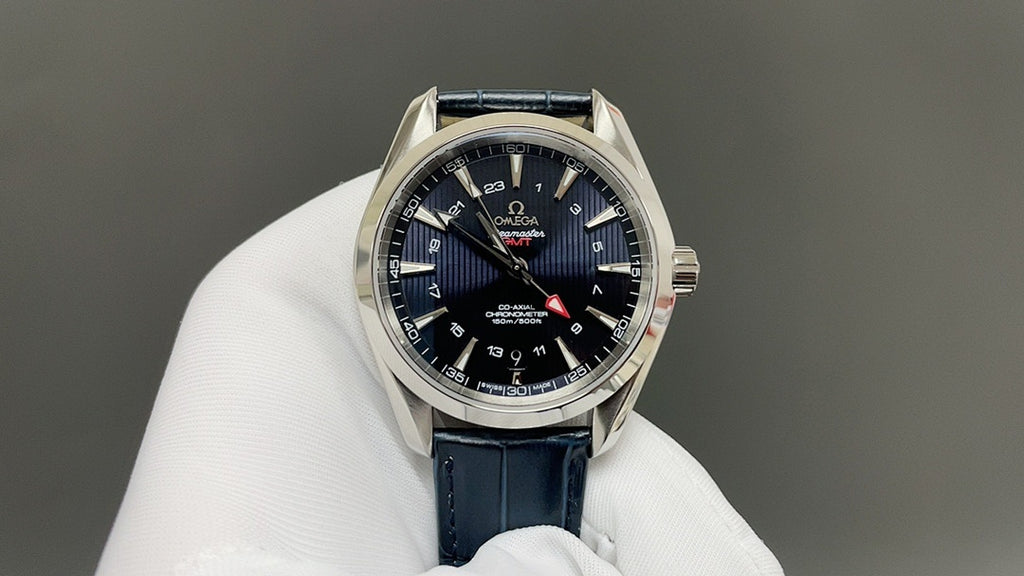 Wristwatch with dark blue dial and blue leather strap, silver bezel and date ring